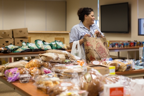 Classified employees attend a food distribution event.